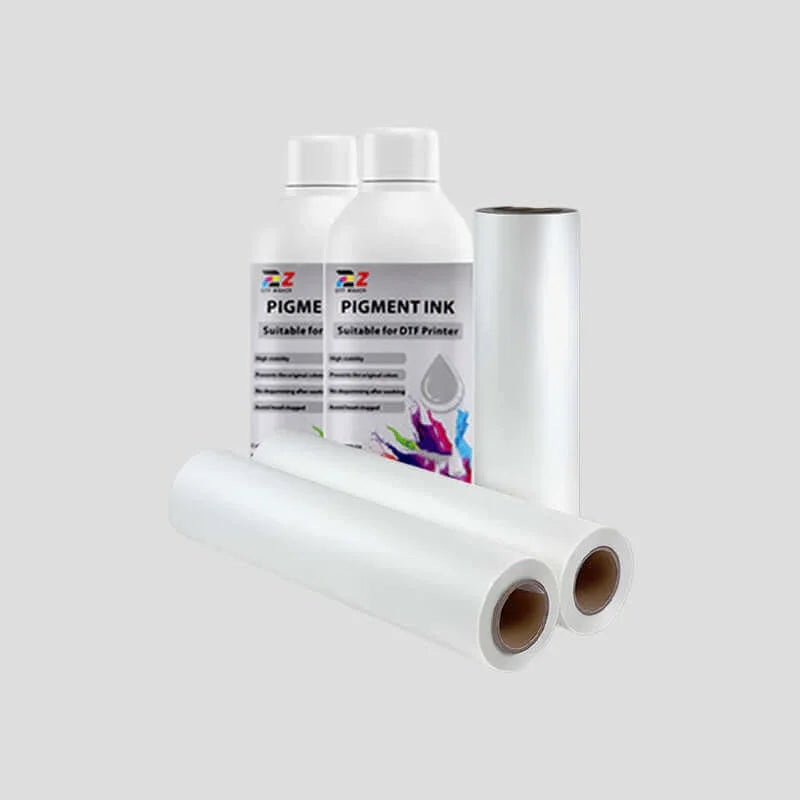 Rolls of paper and a bottle of pigment ink on a white background